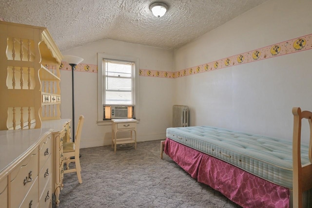 carpeted bedroom featuring cooling unit, a textured ceiling, radiator heating unit, baseboards, and lofted ceiling