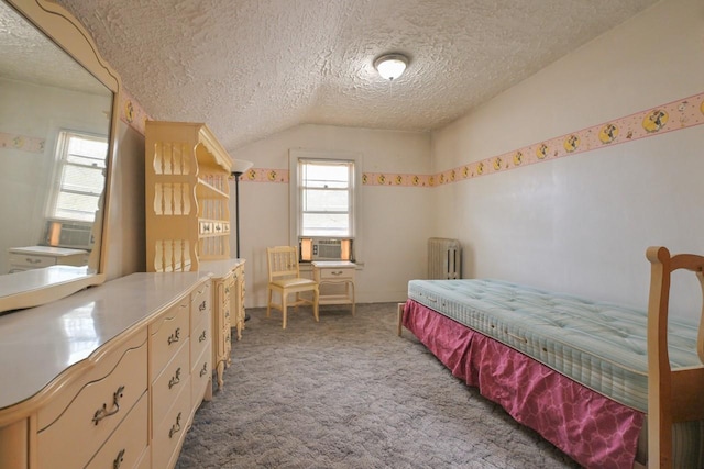 carpeted bedroom featuring radiator, cooling unit, vaulted ceiling, and a textured ceiling