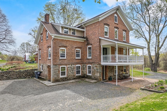 353 Berea Rd, Walden, NY 12586 - view of front of home with stone siding, a patio, roof with shingles, a chimney, and brick siding