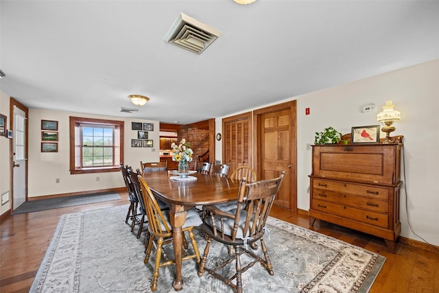 353 Berea Rd, Walden, NY 12586 - dining space with baseboards, wood finished floors, and visible vents