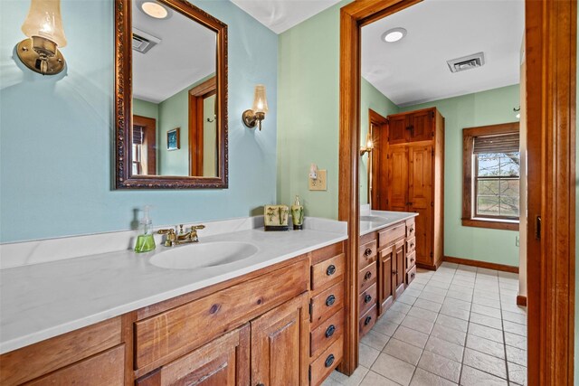 353 Berea Rd, Walden, NY 12586 - full bath with visible vents, a sink, tile patterned floors, and double vanity