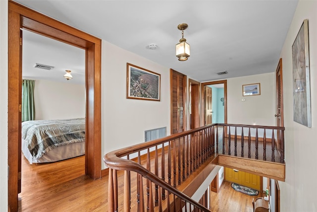 353 Berea Rd, Walden, NY 12586 - hall featuring visible vents, an upstairs landing, and light wood finished floors