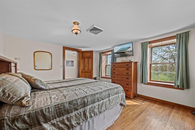 353 Berea Rd, Walden, NY 12586 - bedroom featuring baseboards, multiple windows, light wood-style flooring, and visible vents