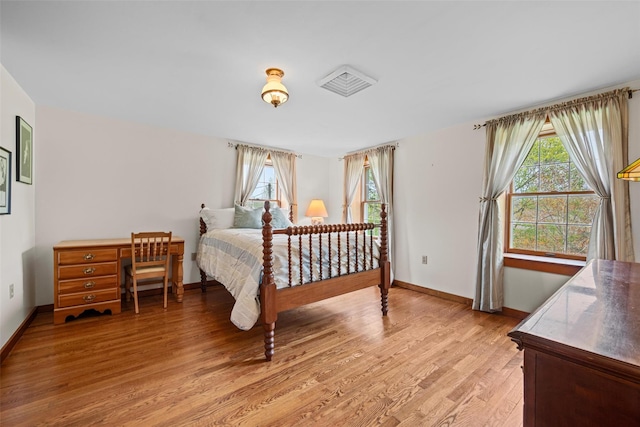 353 Berea Rd, Walden, NY 12586 - bedroom with baseboards, multiple windows, and light wood finished floors