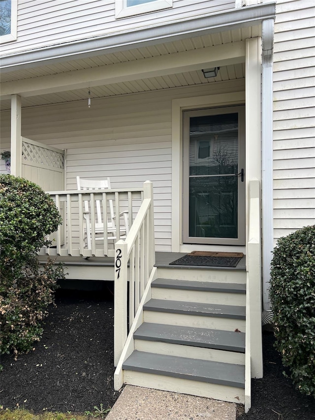 207 Cornwall Meadows Ln, Patterson, NY 12563 - doorway to property featuring a porch