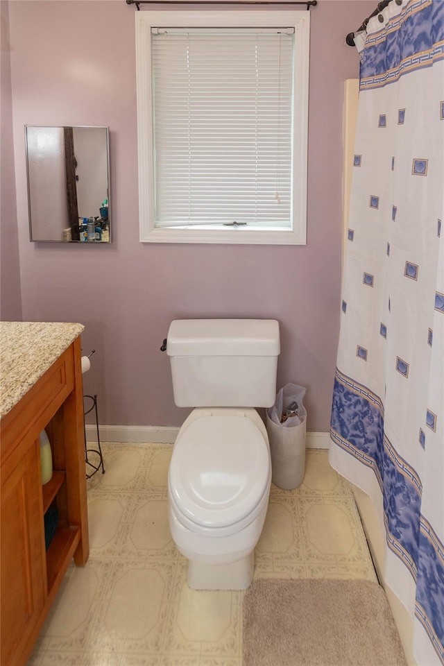 207 Cornwall Meadows Ln, Patterson, NY 12563 - bathroom featuring baseboards, toilet, vanity, and curtained shower