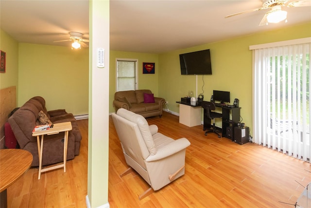 207 Cornwall Meadows Ln, Patterson, NY 12563 - living room featuring a ceiling fan, light wood-style floors, a baseboard radiator, and an office area