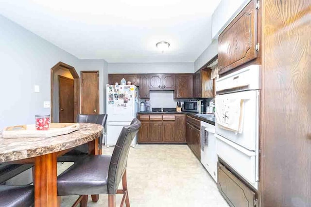 148 Chandler Ln, Montgomery, NY 12549 - kitchen featuring white appliances
