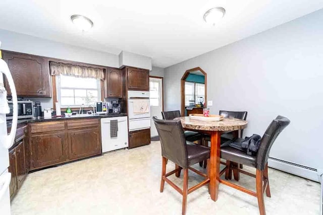 148 Chandler Ln, Montgomery, NY 12549 - kitchen featuring dishwashing machine, a sink, dark countertops, oven, and a warming drawer
