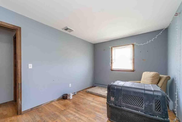 148 Chandler Ln, Montgomery, NY 12549 - interior space featuring a baseboard radiator, visible vents, and wood finished floors