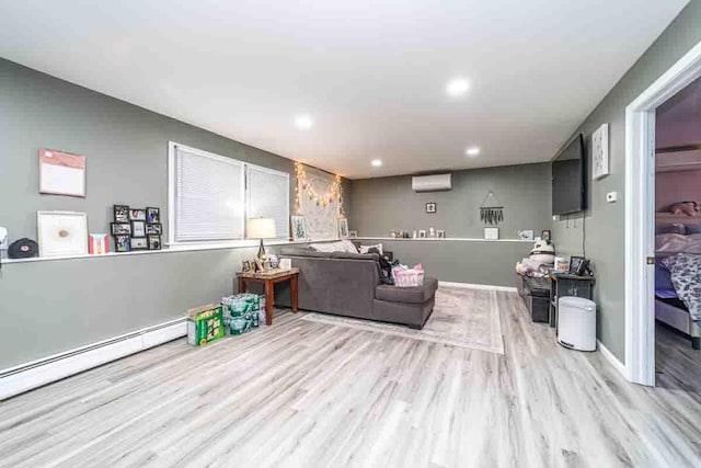 148 Chandler Ln, Montgomery, NY 12549 - living room featuring a baseboard heating unit, a wall mounted air conditioner, recessed lighting, and wood finished floors
