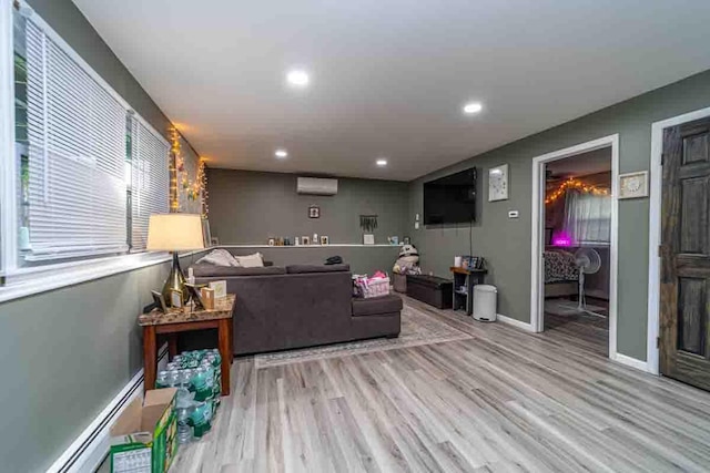 148 Chandler Ln, Montgomery, NY 12549 - living room featuring recessed lighting, an AC wall unit, baseboard heating, and wood finished floors