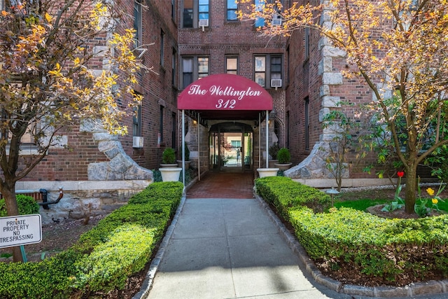property entrance with brick siding