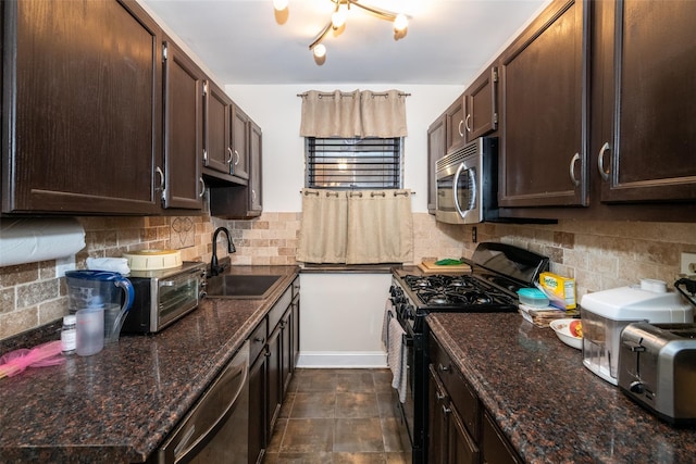 kitchen with a sink, decorative backsplash, appliances with stainless steel finishes, and dark brown cabinetry