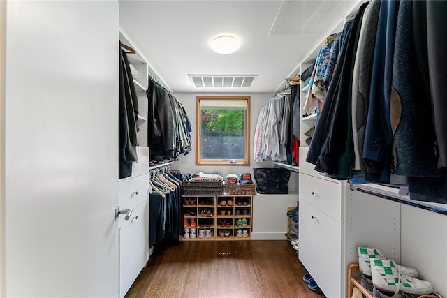 walk in closet featuring visible vents and wood finished floors