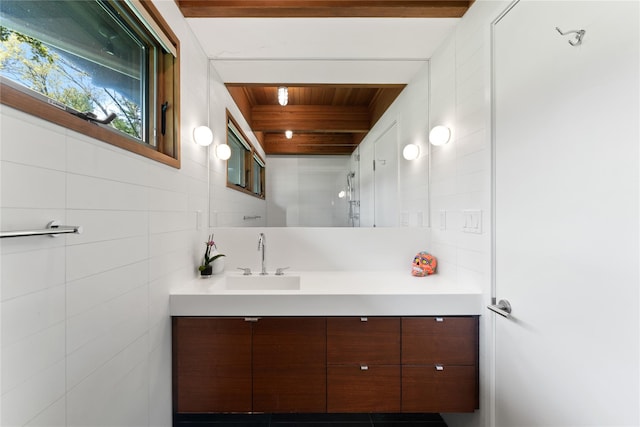bathroom featuring wooden ceiling, vanity, and tile walls