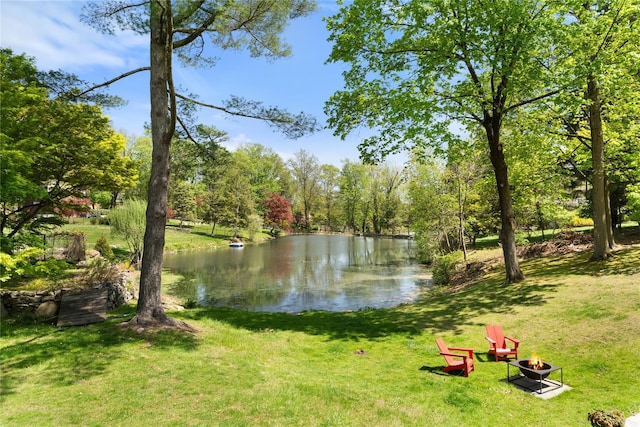 property view of water featuring a fire pit