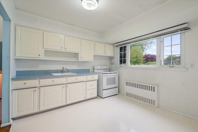 kitchen featuring baseboards, radiator, white electric range, and a sink