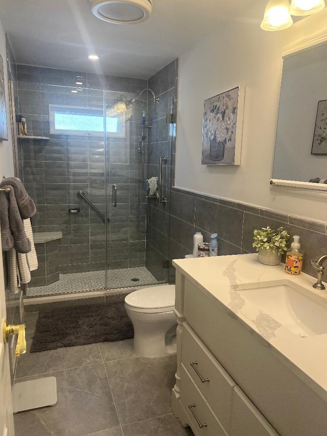84-08 164th Ave, Howard Beach, NY 11414 - full bath with a wainscoted wall, a stall shower, toilet, tile walls, and vanity