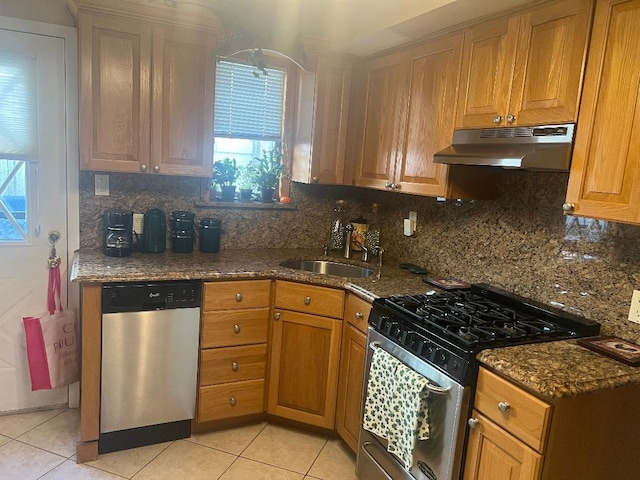 84-08 164th Ave, Howard Beach, NY 11414 - kitchen featuring appliances with stainless steel finishes, light tile patterned floors, a healthy amount of sunlight, and under cabinet range hood