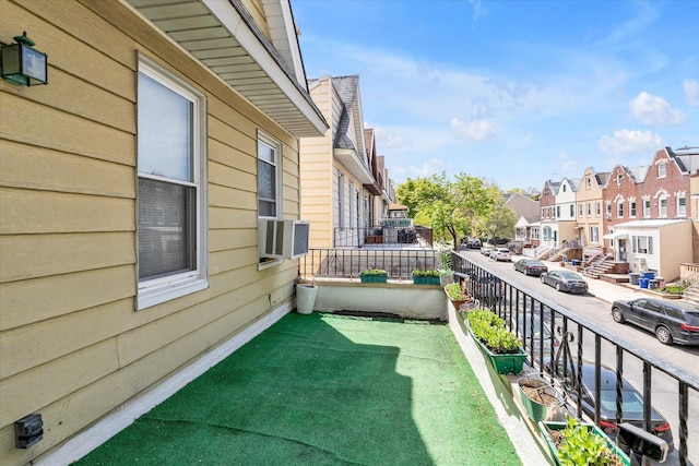 balcony with cooling unit and a residential view