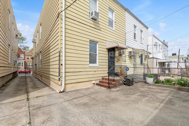 back of house with fence