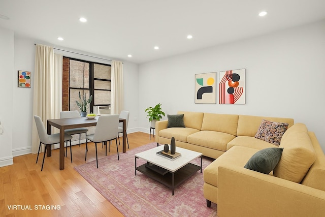 living room with recessed lighting, baseboards, and light wood-style floors