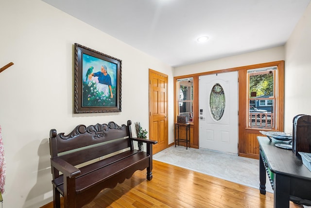 entrance foyer with light wood-type flooring and baseboards