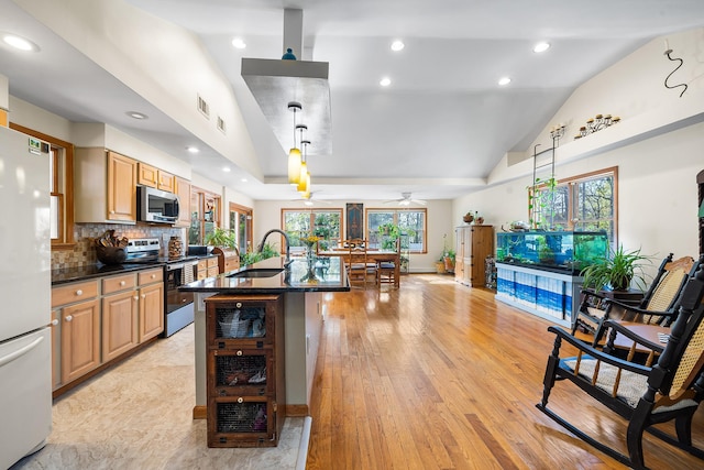kitchen featuring recessed lighting, ceiling fan, appliances with stainless steel finishes, and a sink
