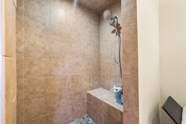 full bathroom with a tile shower