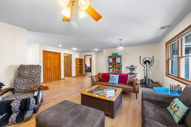 living area featuring a ceiling fan, baseboards, recessed lighting, light wood-type flooring, and visible vents