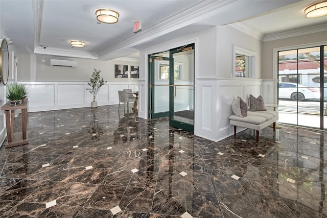 interior space with crown molding, wainscoting, a decorative wall, and an AC wall unit