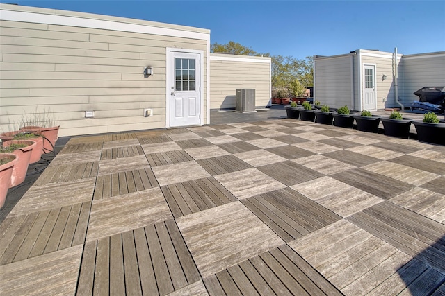 wooden terrace with outdoor dining space