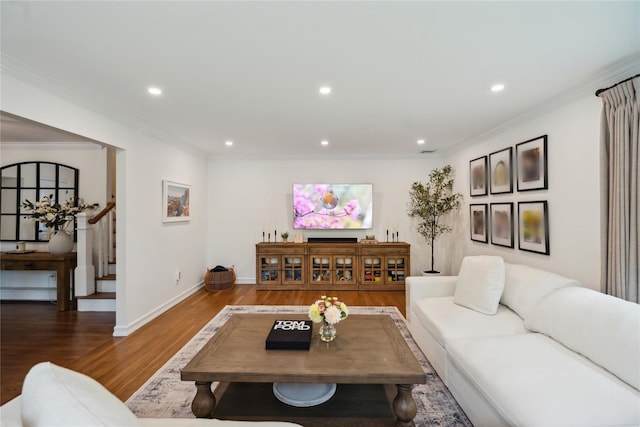living room with wood finished floors, stairs, recessed lighting, crown molding, and baseboards