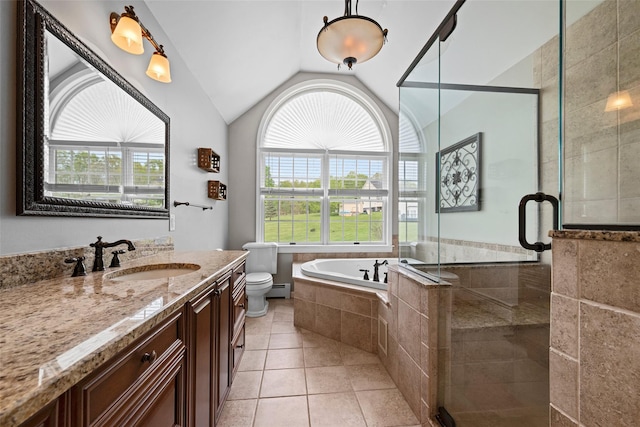 full bathroom featuring vanity, toilet, vaulted ceiling, a garden tub, and a stall shower
