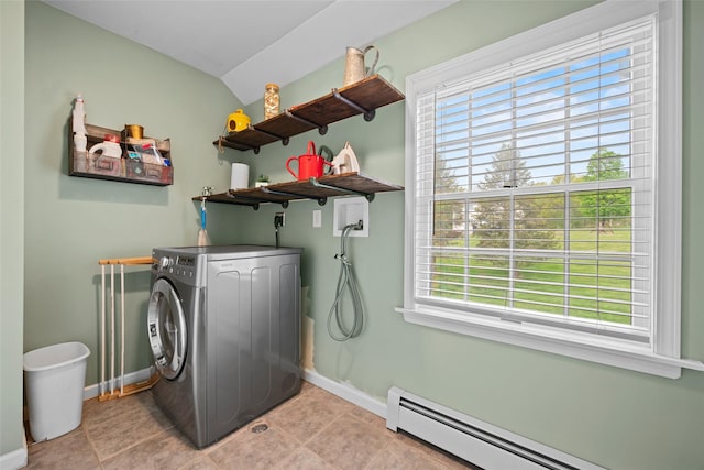 laundry room with laundry area, washer / clothes dryer, baseboard heating, light tile patterned floors, and baseboards