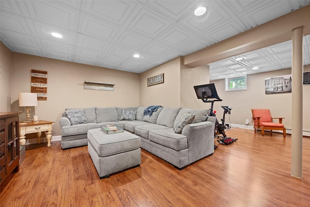 living area with recessed lighting, baseboards, and light wood-style flooring