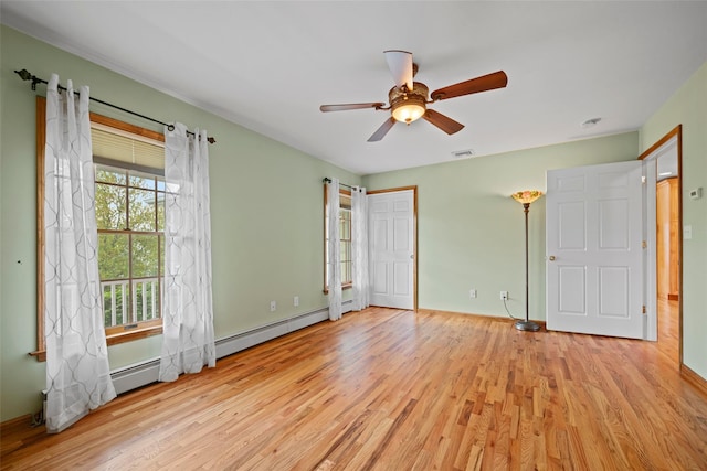 unfurnished bedroom featuring visible vents, a ceiling fan, baseboards, and wood finished floors