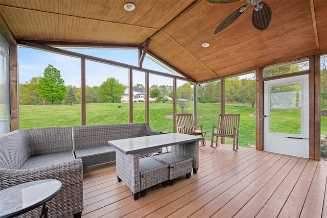 sunroom / solarium with an outdoor living space, a ceiling fan, and a wealth of natural light
