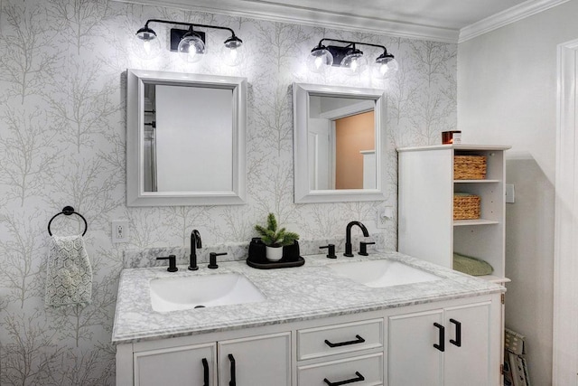 bathroom with wallpapered walls, crown molding, double vanity, and a sink