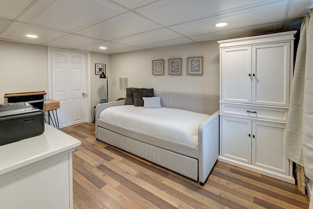 bedroom featuring visible vents, recessed lighting, and light wood-type flooring