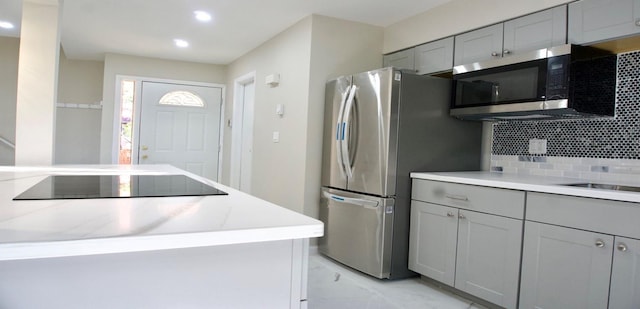 11 Lakeview Ct, Rock Hill, NY 12775 - kitchen featuring tasteful backsplash, recessed lighting, appliances with stainless steel finishes, light countertops, and gray cabinetry