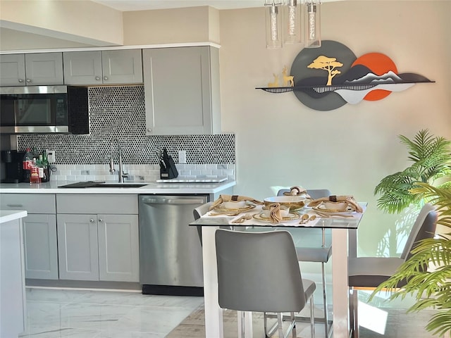 11 Lakeview Ct, Rock Hill, NY 12775 - kitchen with gray cabinetry, stainless steel appliances, light countertops, and a sink