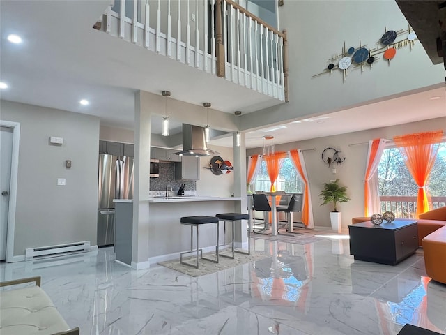 11 Lakeview Ct, Rock Hill, NY 12775 - living area featuring recessed lighting, a baseboard radiator, marble finish floor, baseboards, and a high ceiling