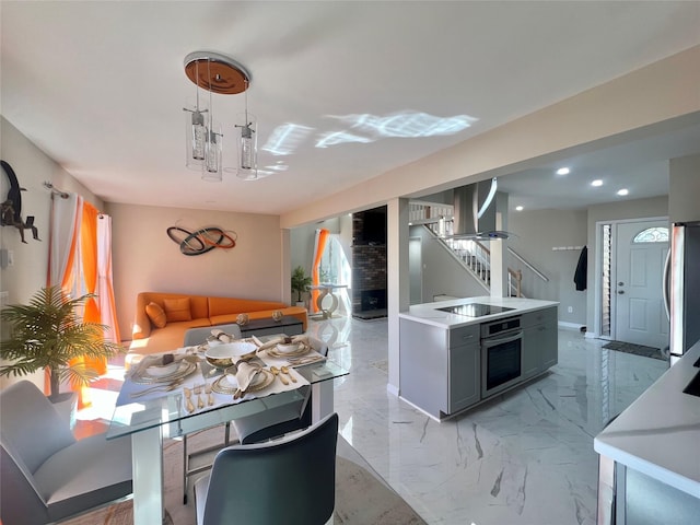 11 Lakeview Ct, Rock Hill, NY 12775 - kitchen with wall chimney range hood, light countertops, oven, black electric cooktop, and refrigerator