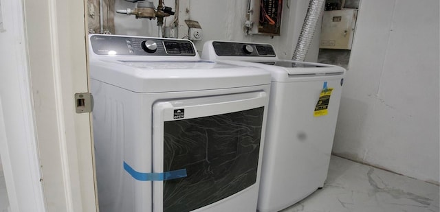11 Lakeview Ct, Rock Hill, NY 12775 - laundry room with marble finish floor, washing machine and clothes dryer, electric panel, and laundry area
