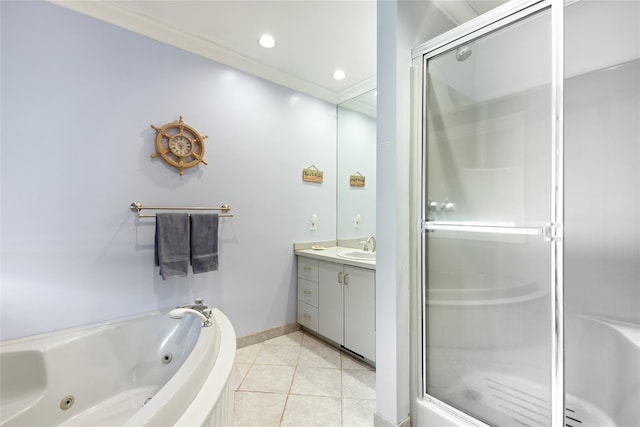 bathroom with a shower stall, baseboards, a tub with jets, vanity, and tile patterned flooring
