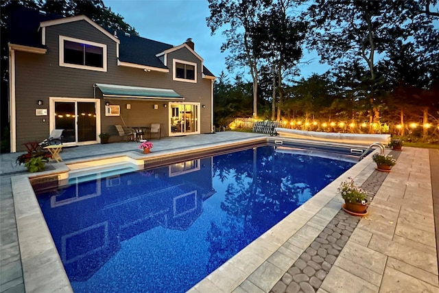 view of pool featuring a covered pool and a patio area