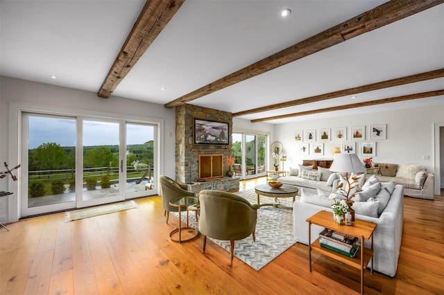 3585 Rte 82, Millbrook, NY 12545 - living area with light wood-style floors, beam ceiling, a stone fireplace, and recessed lighting