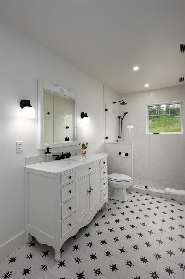 3585 Rte 82, Millbrook, NY 12545 - full bath featuring toilet, tiled shower, vanity, and recessed lighting